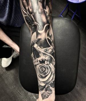 Healed half sleeve, skull & roses